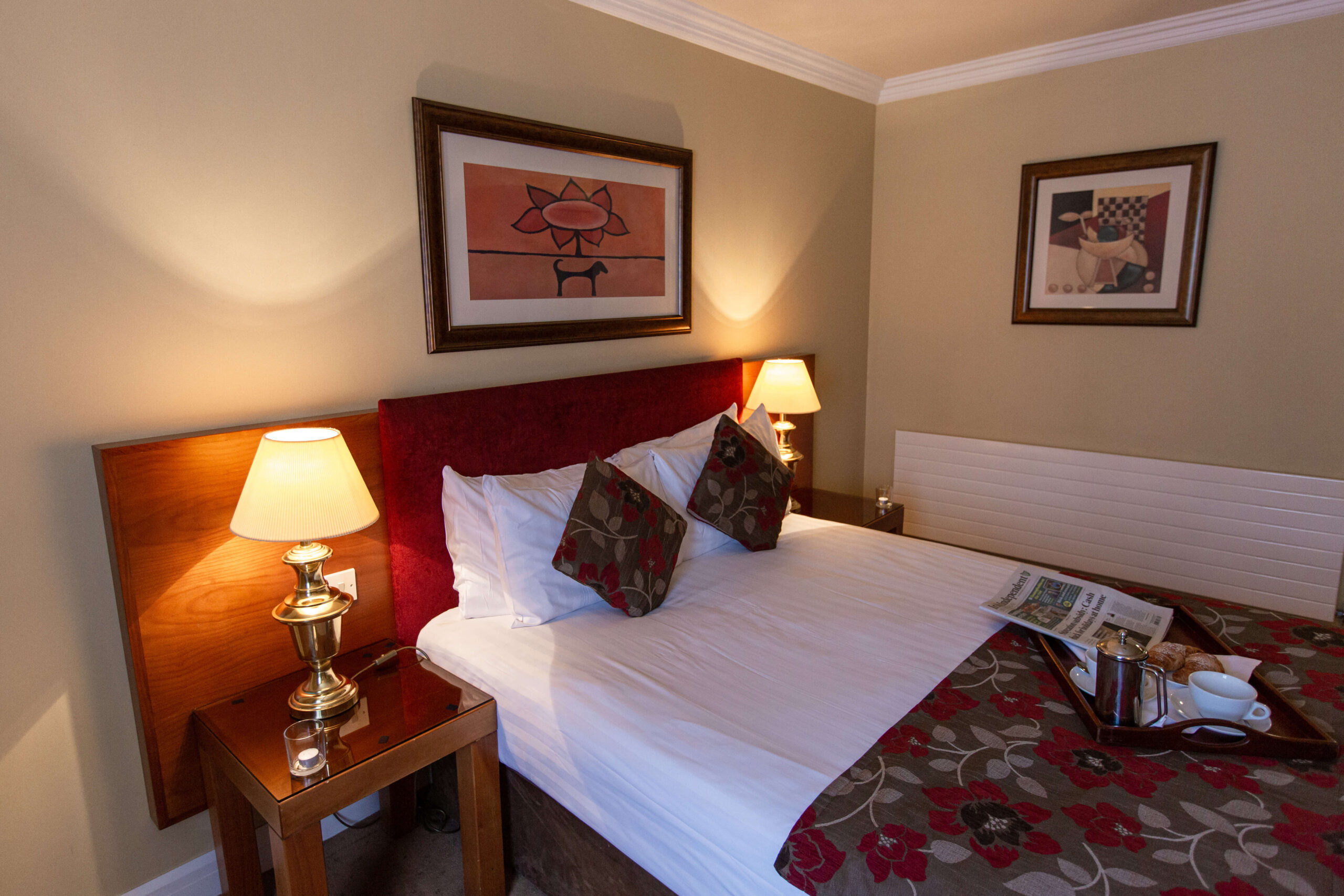 Cosy hotel room with warm lighting and floral decor at Hamlet Court Hotel.