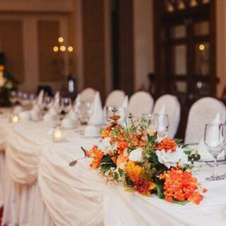 Elegant dining setup with floral centrepieces at Hamlet Court Hotel.