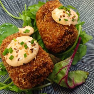Delicious croquettes atop fresh greens with a creamy, spicy sauce at Hamlet Court Hotel.