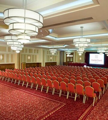 Elegant conference room with red seating at Hamlet Court Hotel