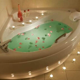 Romantic bathtub with candles and rose petals at Hamlet Court Hotel.