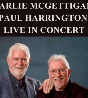 Two musicians smiling against a blue background, text above reads "Charlie McGettigan & Paul Harrington Live in Concert".