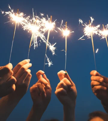 Guests holding sparklers aloft at dusk, warm celebratory mood outside Hamlet Court Hotel (Hamlet Court Hotel)